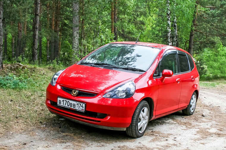 Red Honda saloon car