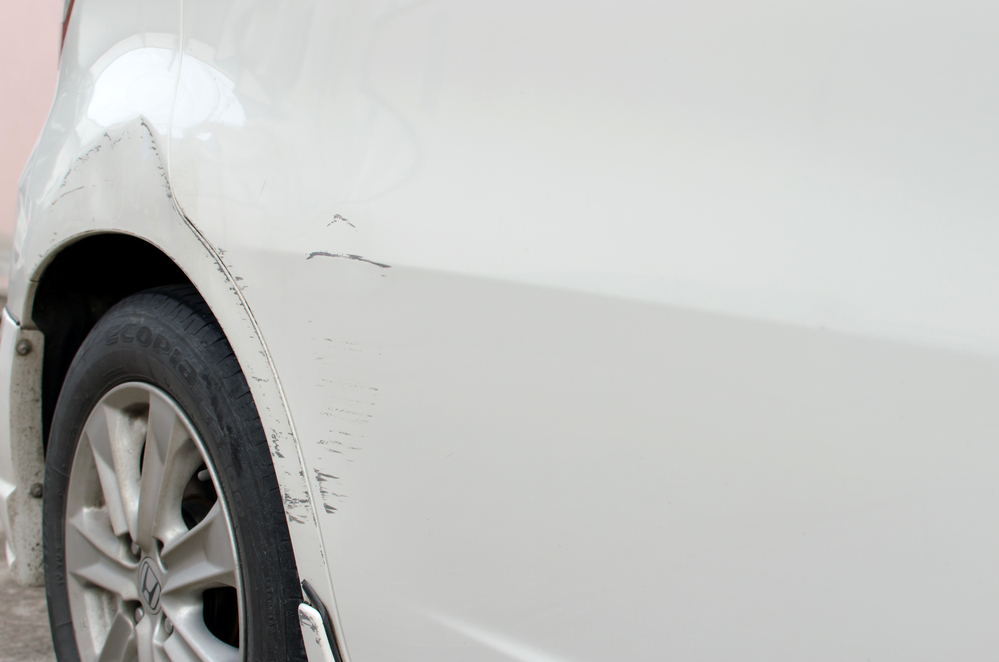 Scratched body of a car