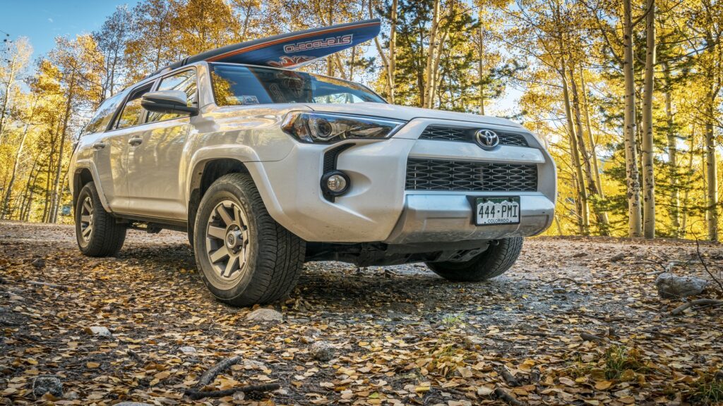 A Toyota Sequoia parked in a scenic mountain landscape, highlighting its towing and hauling capabilities.