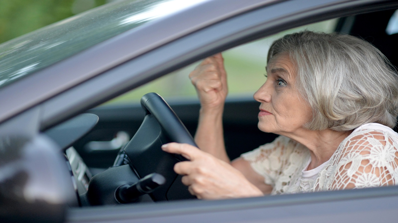 Car Driving Senior Woman