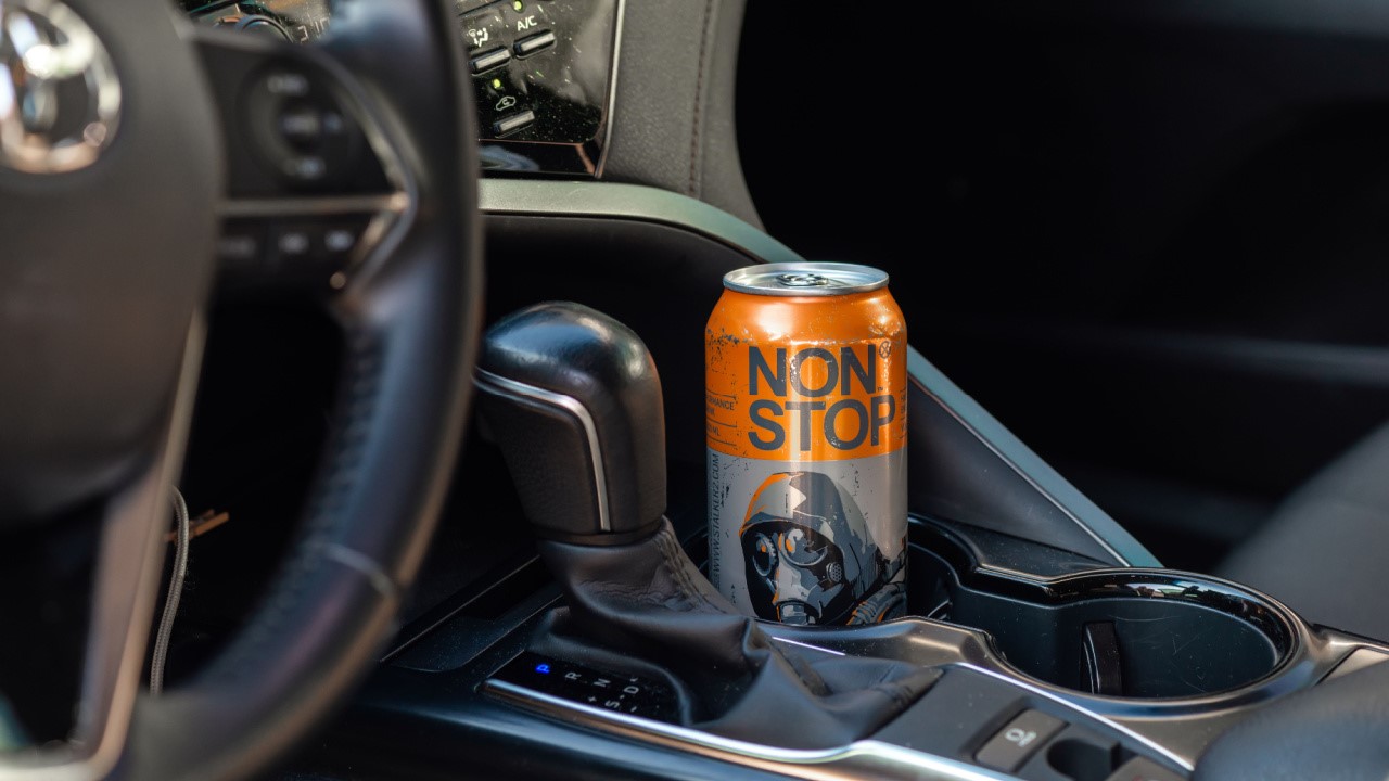 Canned non stop stalker energy drink, canned beverage in the car